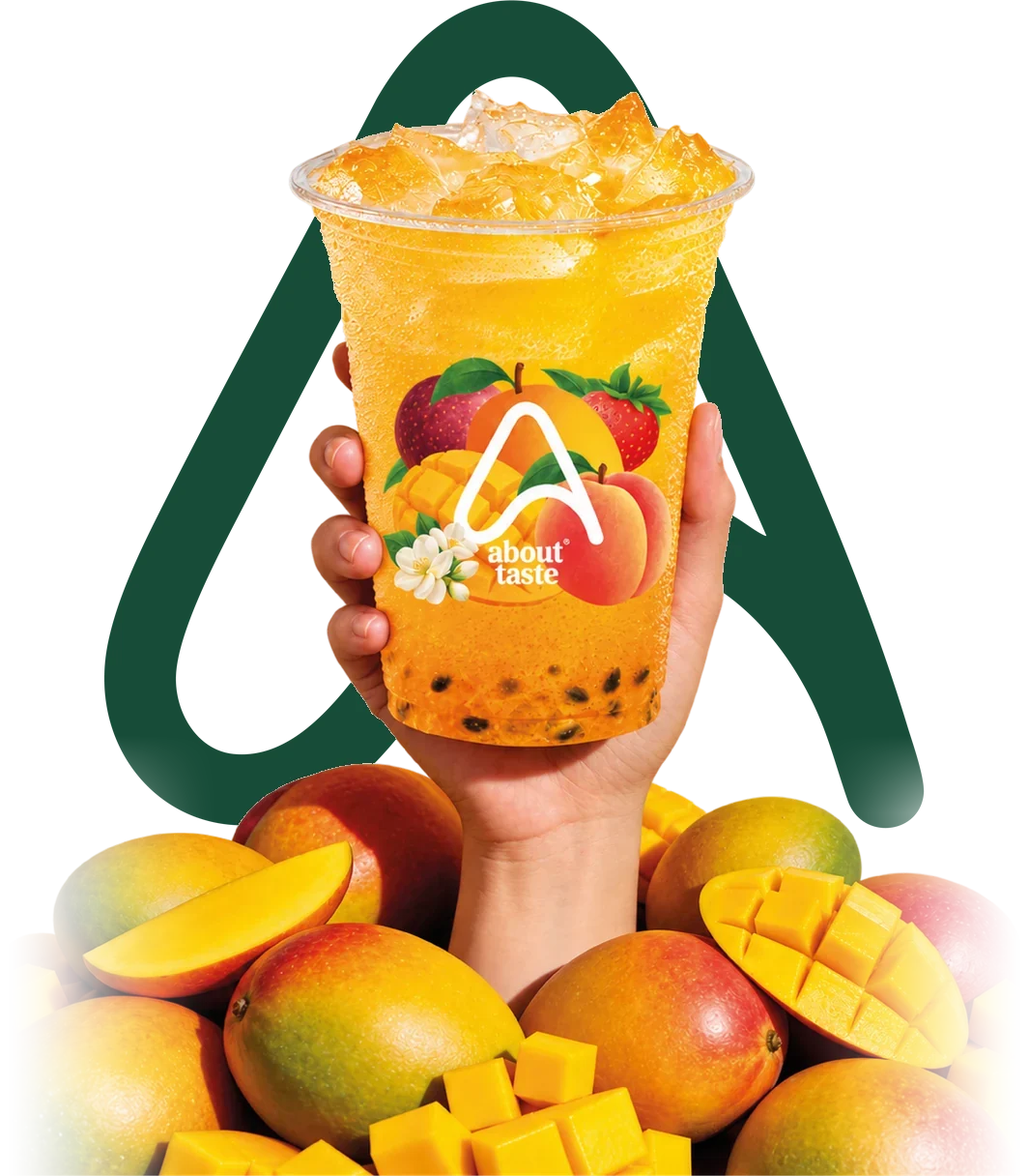 A hand holding up an About Taste mango juice above a pile of fresh mangoes